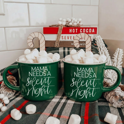 Two green Gia Roma Mama Silent Night mugs filled with marshmallows and candy canes on plaid backdrop on Tampa Home & Garden Store