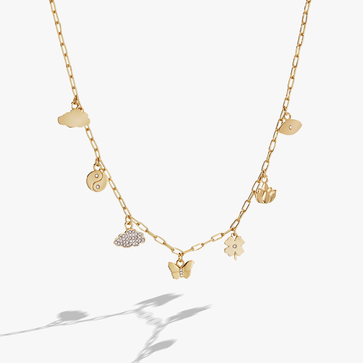 Silver Linings Charm Necklace gold-tone chain with cloud, yin-yang, butterfly charms on Tampa Home & Garden Store