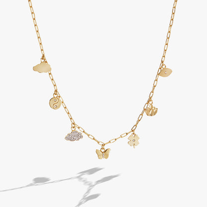 Silver Linings Charm Necklace gold-tone chain with cloud, yin-yang, butterfly charms on Tampa Home & Garden Store