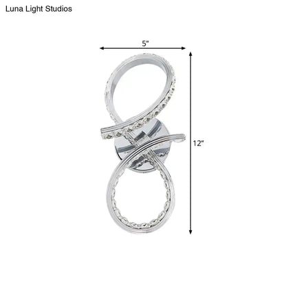 Chrome infinity wall sconce with two interlocking crystal rings, 5in wide by 12in tall on Tampa Home & Garden Store