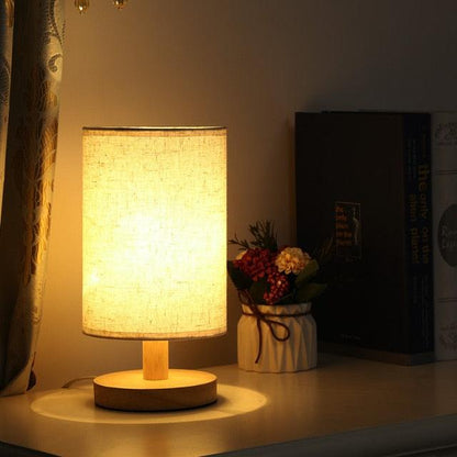 Stevvex bedside table lamp with beige fabric shade and solid wood base on Tampa Home & Garden Store