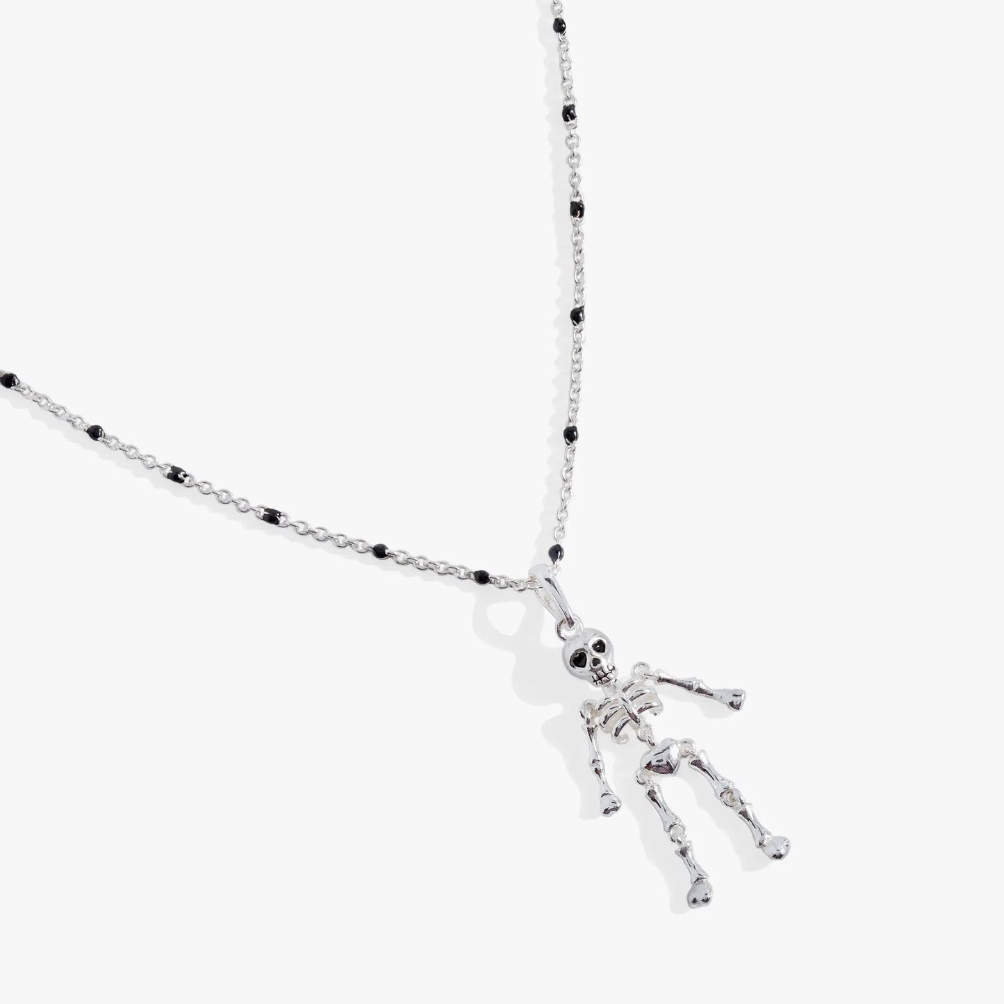 Skeleton necklace by ALEX AND ANI with a silver chain, black bead accents, and skeleton pendant on Tampa Home & Garden Store