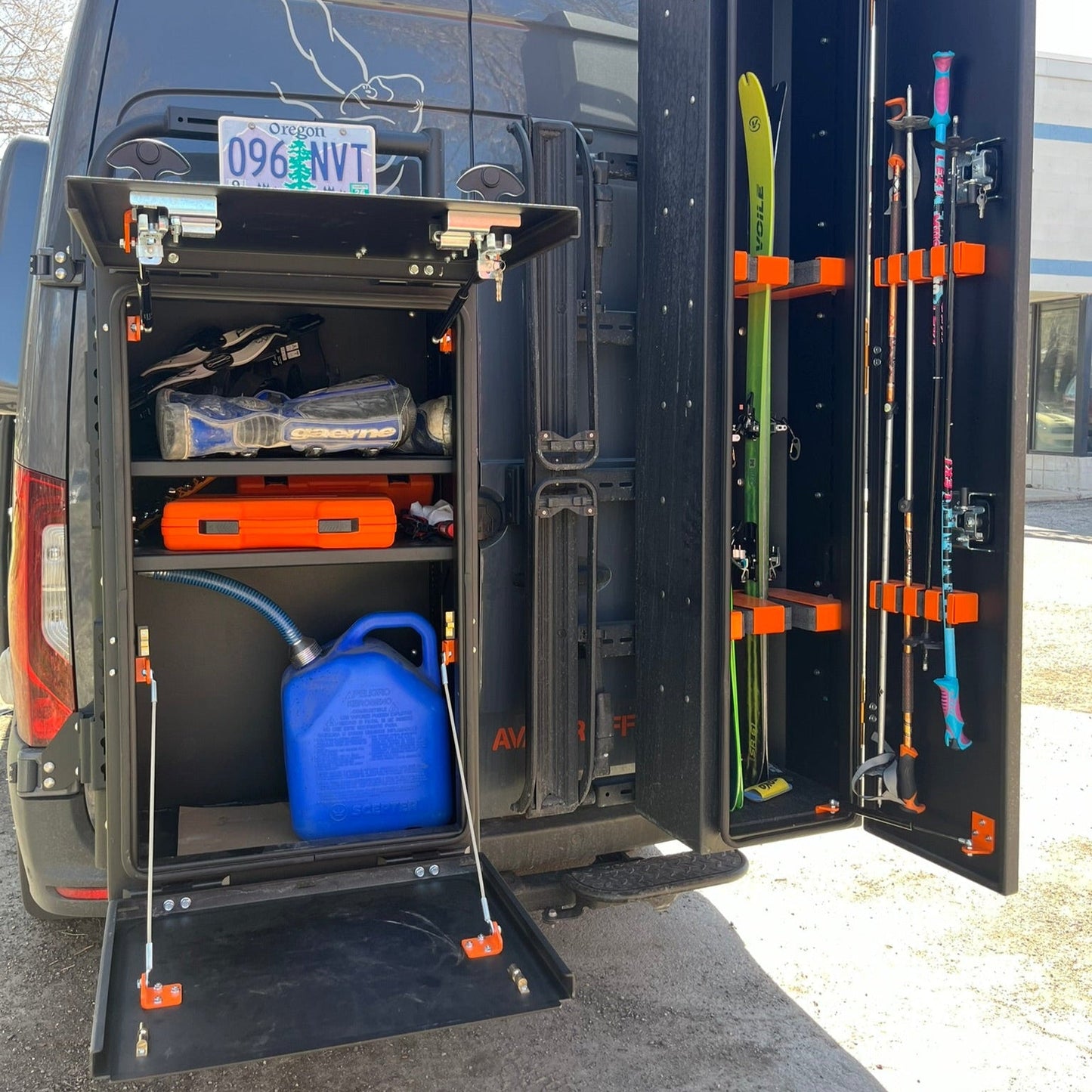 Avatar Mega Storage Box mounted in a van cabinet with orange latches and gear nearby on Tampa Home & Garden Store