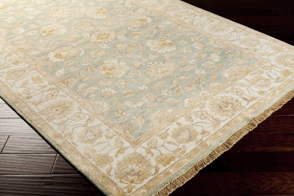 Skipwith Area Carpet rug with pale blue-green field and cream border floral motif on Tampa Home & Garden Store