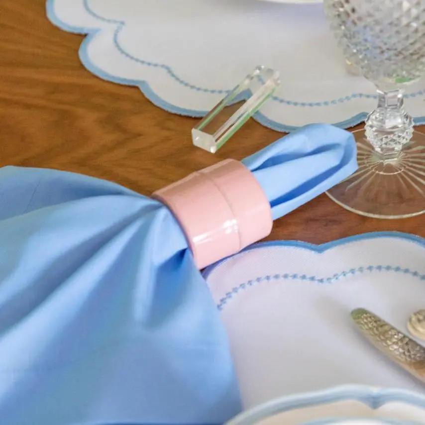 Solid cotton napkin in blue with pink napkin ring for elegant tables by Talah Home on Tampa Home & Garden Store