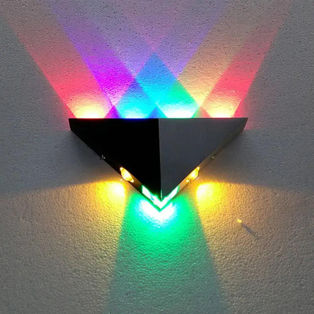 Black pyramid RGB wall lamp by Decorbites; LED wall sconce projecting colorful light on wall on Tampa Home & Garden Store