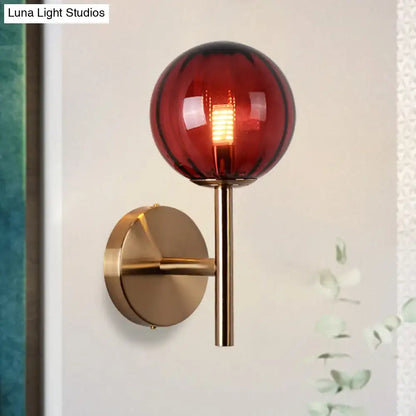 Decorbites amber red glass wall sconce with brass mount on Tampa Home & Garden Store