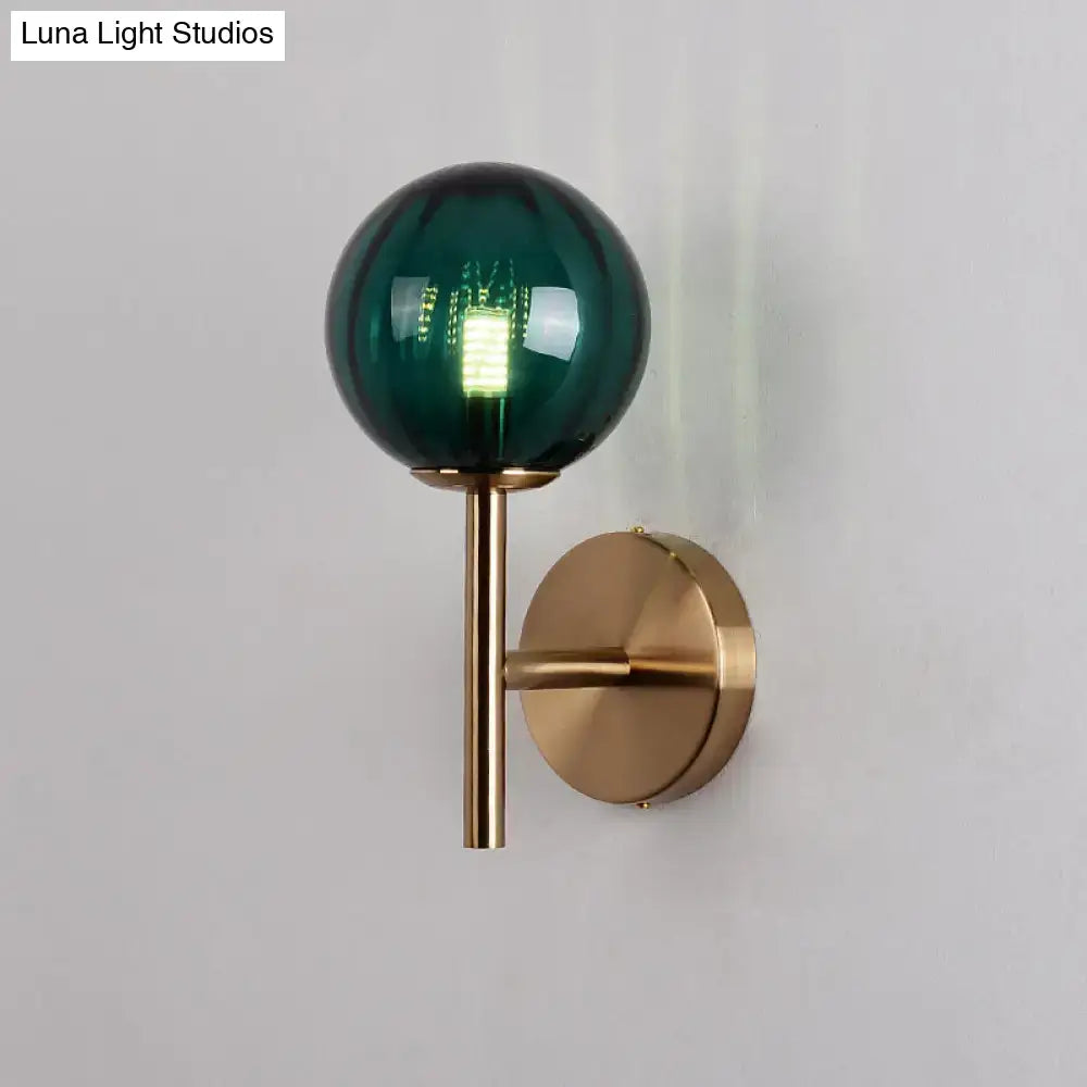 Amber Red Green Glass Wall Sconce featuring a green glass globe on a brass wall mount on Tampa Home & Garden Store