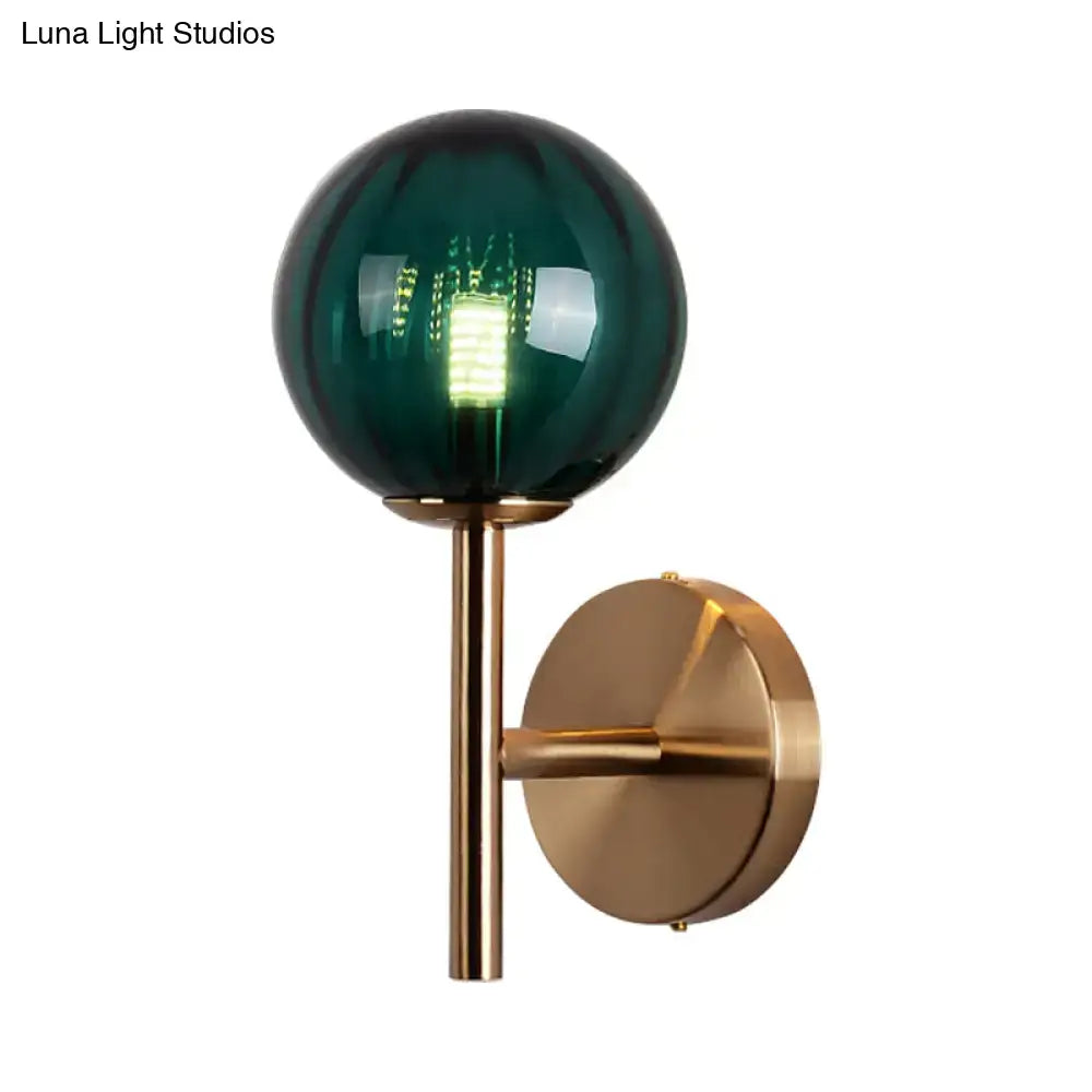 Amber Red Green Glass Wall Sconce with green glass globe and brass wall mount on Tampa Home & Garden Store