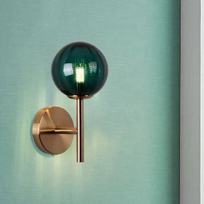 Amber Red Green Glass Wall Sconce with green glass globe and brass mount by Decorbites on Tampa Home & Garden Store
