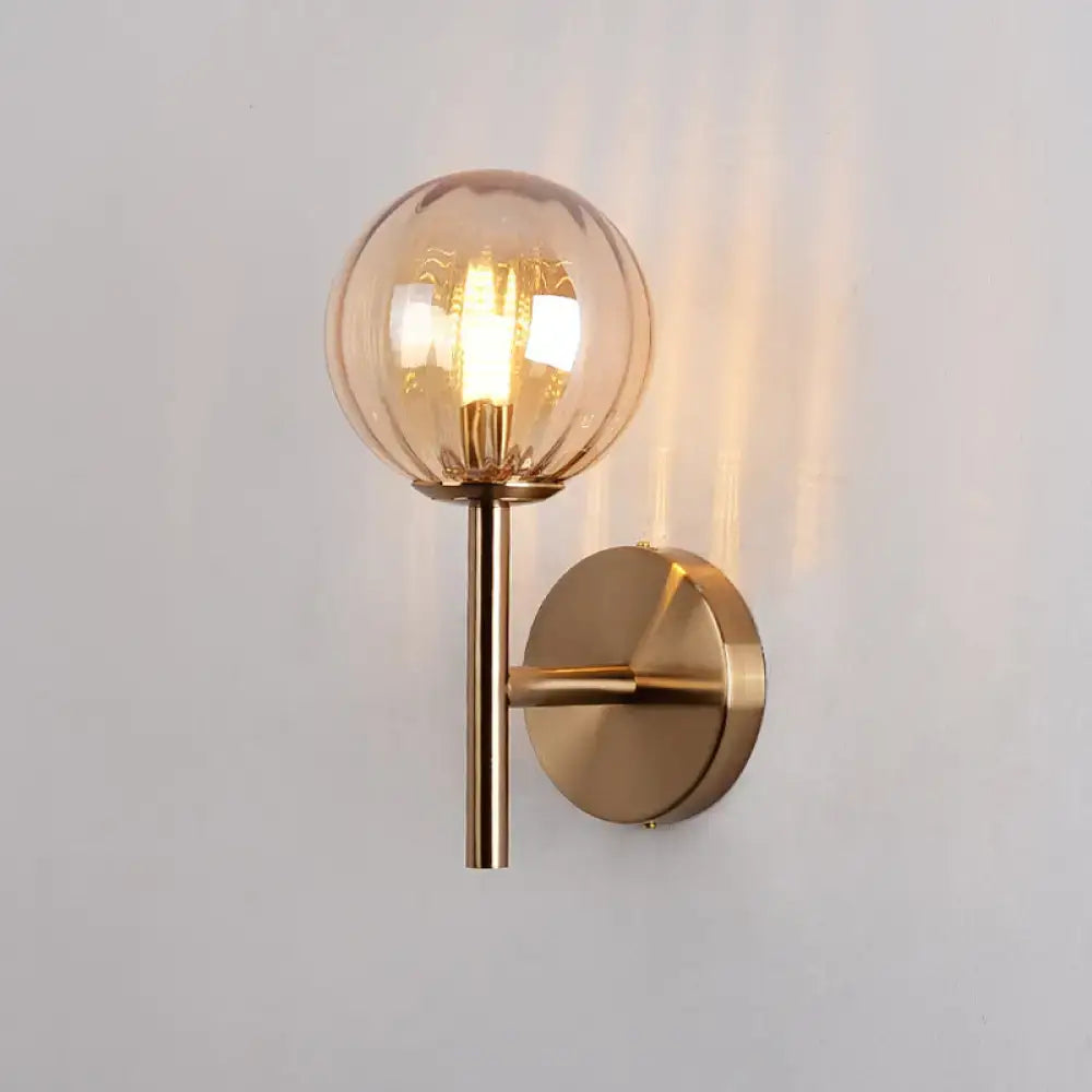 Amber glass globe wall sconce with brass mount by Decorbites on Tampa Home & Garden Store