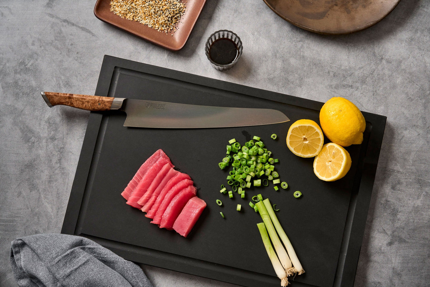 10in STEELPORT slicing knife with wooden handle on black cutting board, lemon and scallions on Tampa Home & Garden Store