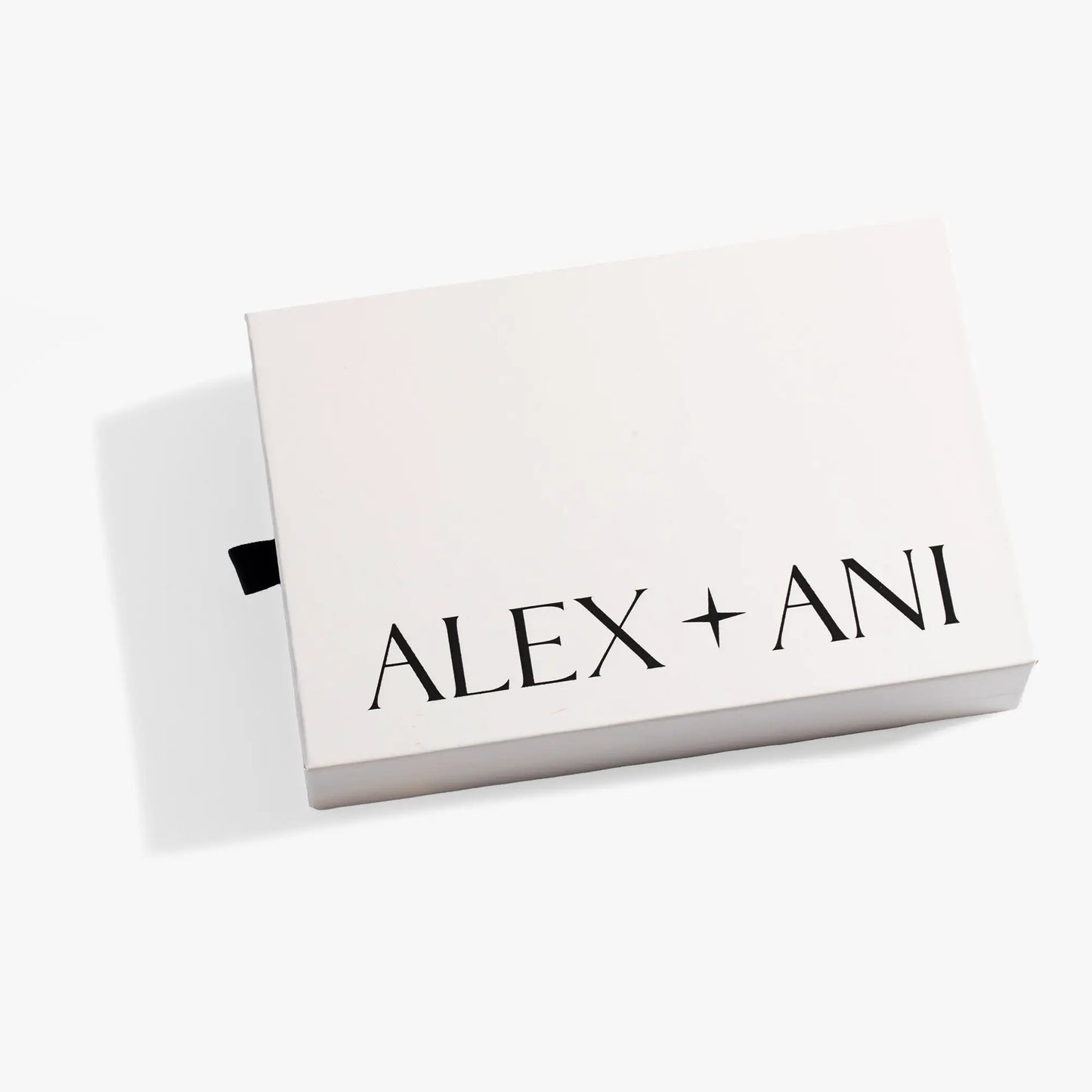 Sliding Gift Box by Alex and Ani, white box with bold black logo and black ribbon pull tab on Tampa Home & Garden Store