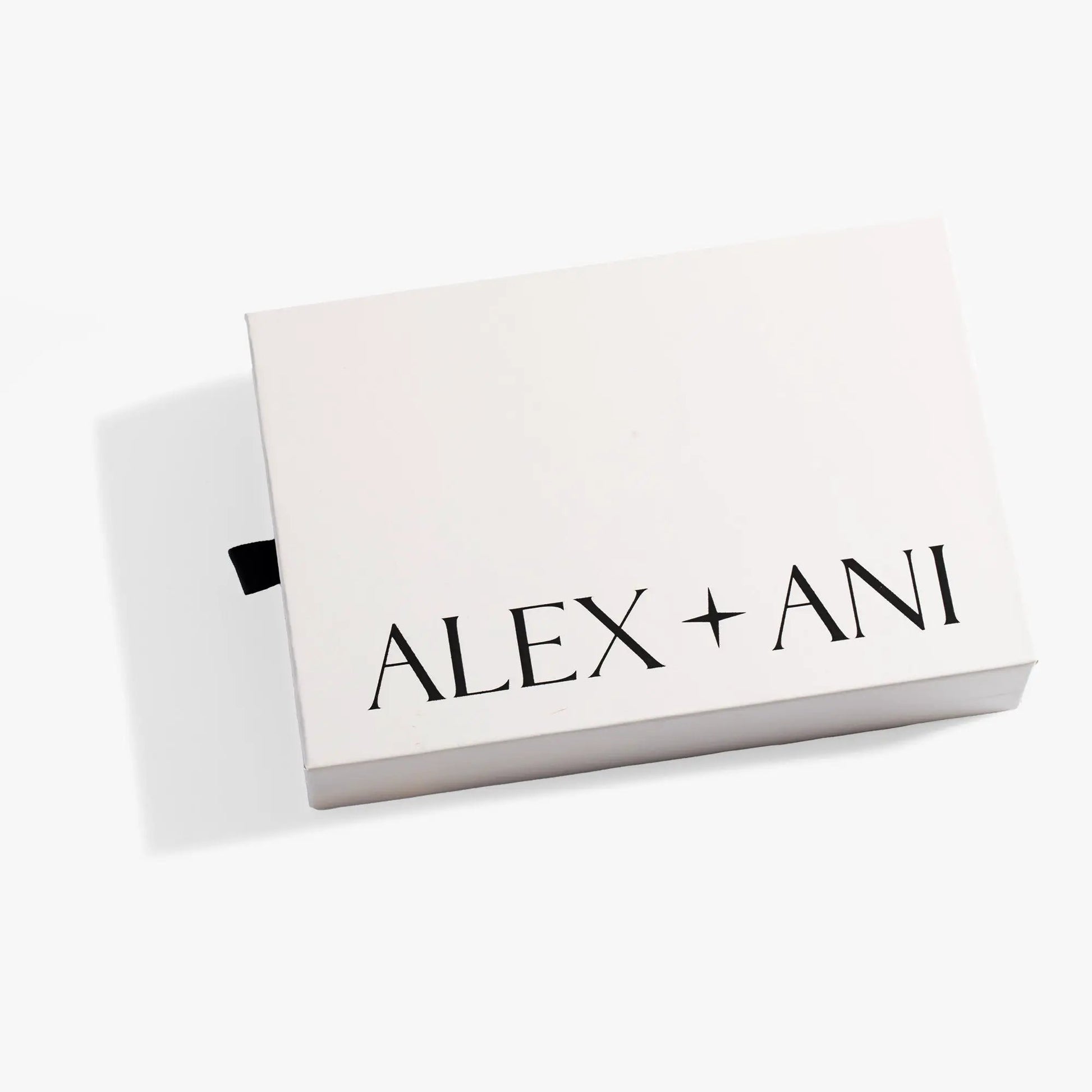 Sliding Gift Box by Alex and Ani, white box with bold black logo and black ribbon pull tab on Tampa Home & Garden Store