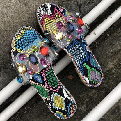 Two Stevvex snake-print jeweled open-toe slides with clear rhinestone straps on Tampa Home & Garden Store
