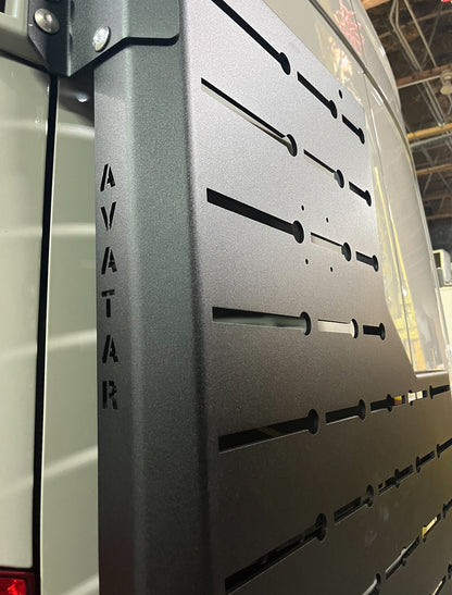 Outpost Sprinter Mounting Carrier mount on van, matte black metal rack with slotted panels Avatar Offroad branding on Tampa Home & Garden Store