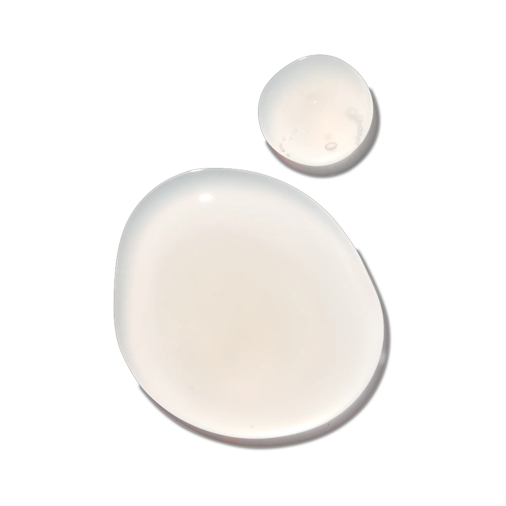 Amika Smooth Over Frizz-Fighting Treatment Mask white cream droplets on black background on Tampa Home & Garden Store