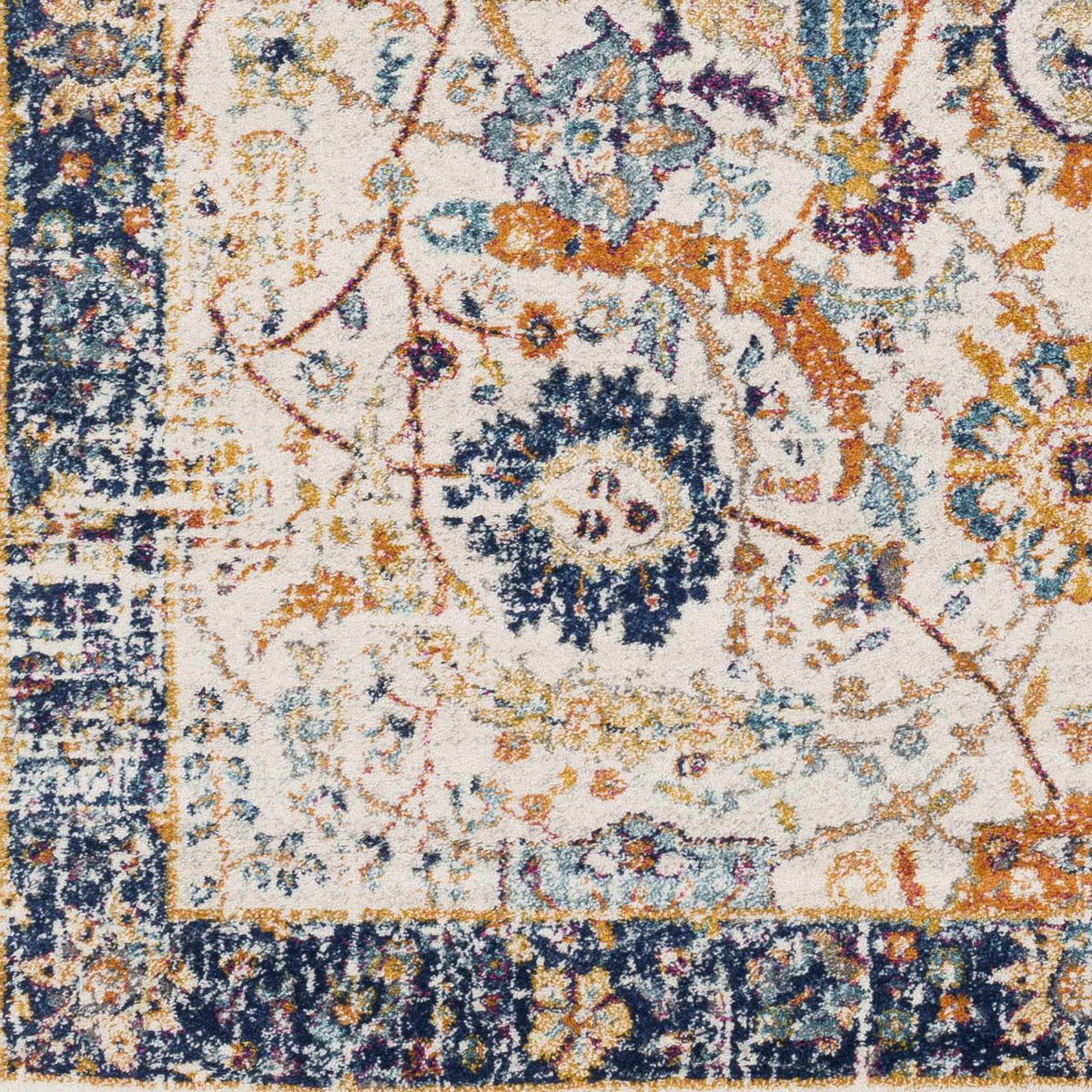 Smyrna Area Rug by Boutique Rugs, ivory field with navy border and multicolor floral motifs on Tampa Home & Garden Store
