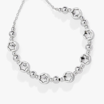 Silver bolo bracelet featuring round snowflake-cut discs and polished beads on Tampa Home & Garden Store