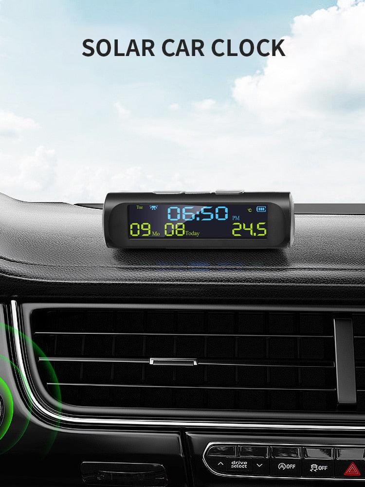 Stevvex solar car clock with LCD time/date and in-car temperature display mounted on dash on Tampa Home & Garden Store