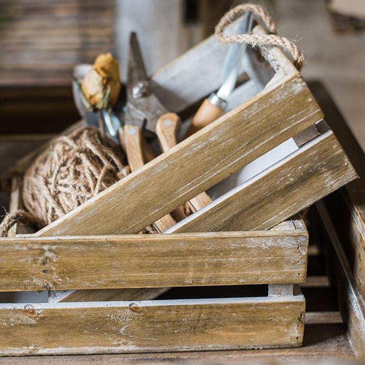 Solid wood crate with rope handles, weathered finish, filled with woodworking hand tools on Tampa Home & Garden Store