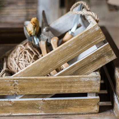 Solid wood crate with rope handles, weathered finish, filled with woodworking hand tools on Tampa Home & Garden Store