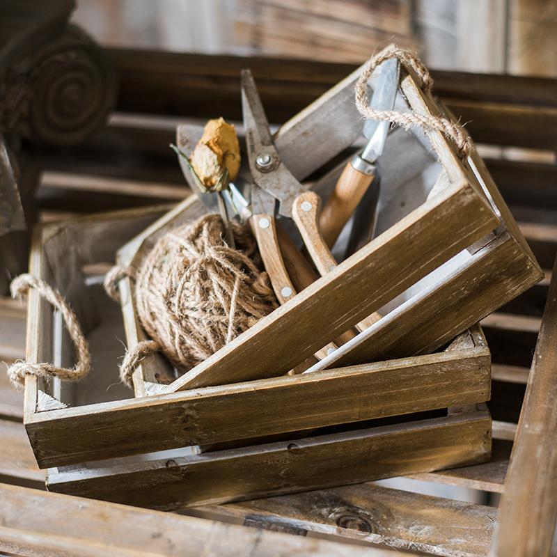 Solid wood crate with rope handles and garden tools inside on Tampa Home & Garden Store
