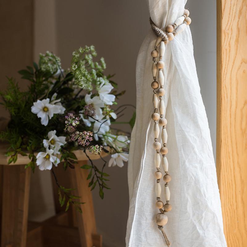 Solid wood rustic curtain tiebacks by RusticReach with wood beads and white linen curtain on Tampa Home & Garden Store