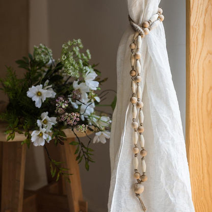 Solid wood rustic curtain tiebacks by RusticReach with wood beads and white linen curtain on Tampa Home & Garden Store