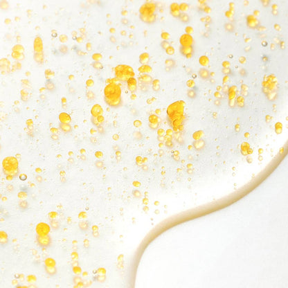 SOME BY MI Yuja Niacin Brightening Body Serum Mist 80ml golden oil droplets on surface on Tampa Home & Garden Store