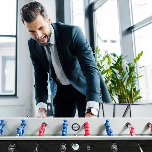 Foosball table 48-inch wooden home recreation DirectDeals with blue red players, man playing on Tampa Home & Garden Store