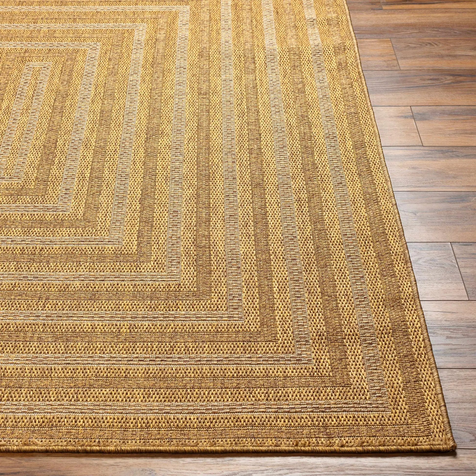 Dyami flatweave faux jute outdoor rug in golden brown tones, Boutique Rugs on Tampa Home & Garden Store