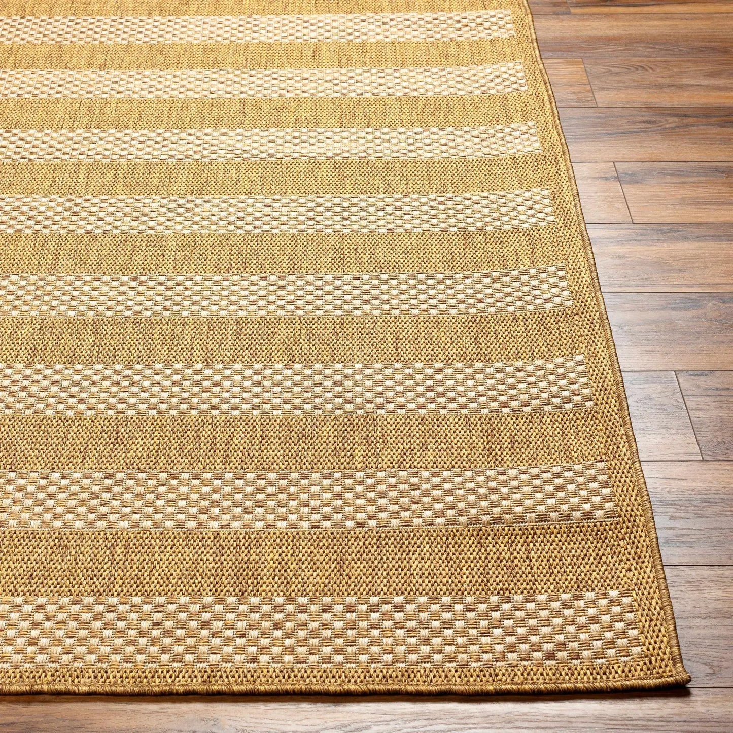 Hiero Flatweave Faux Jute Outdoor Rug tan beige striped textured weave on wood floor on Tampa Home & Garden Store