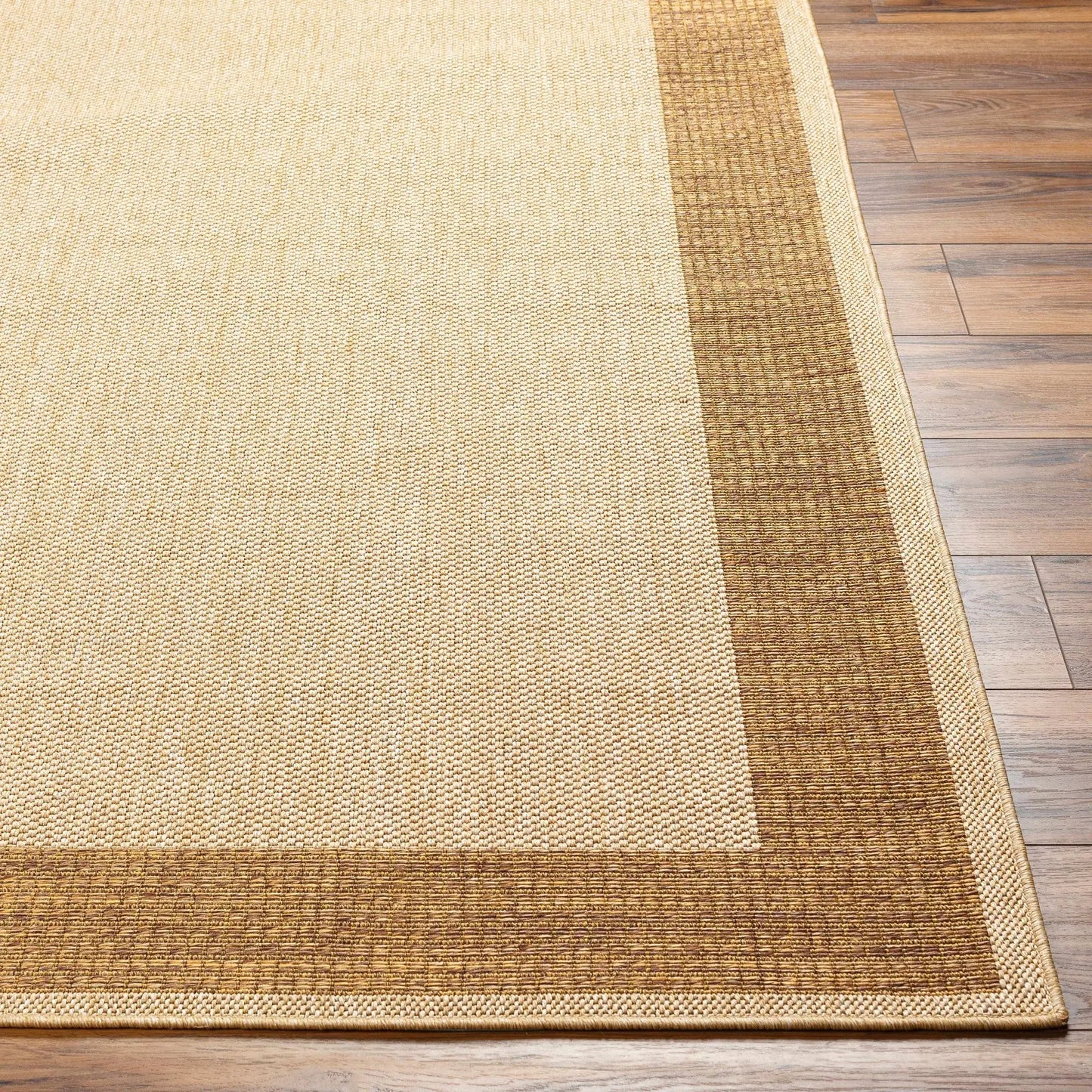Inigo flatweave faux jute outdoor rug beige with brown border Boutique Rugs on Tampa Home & Garden Store