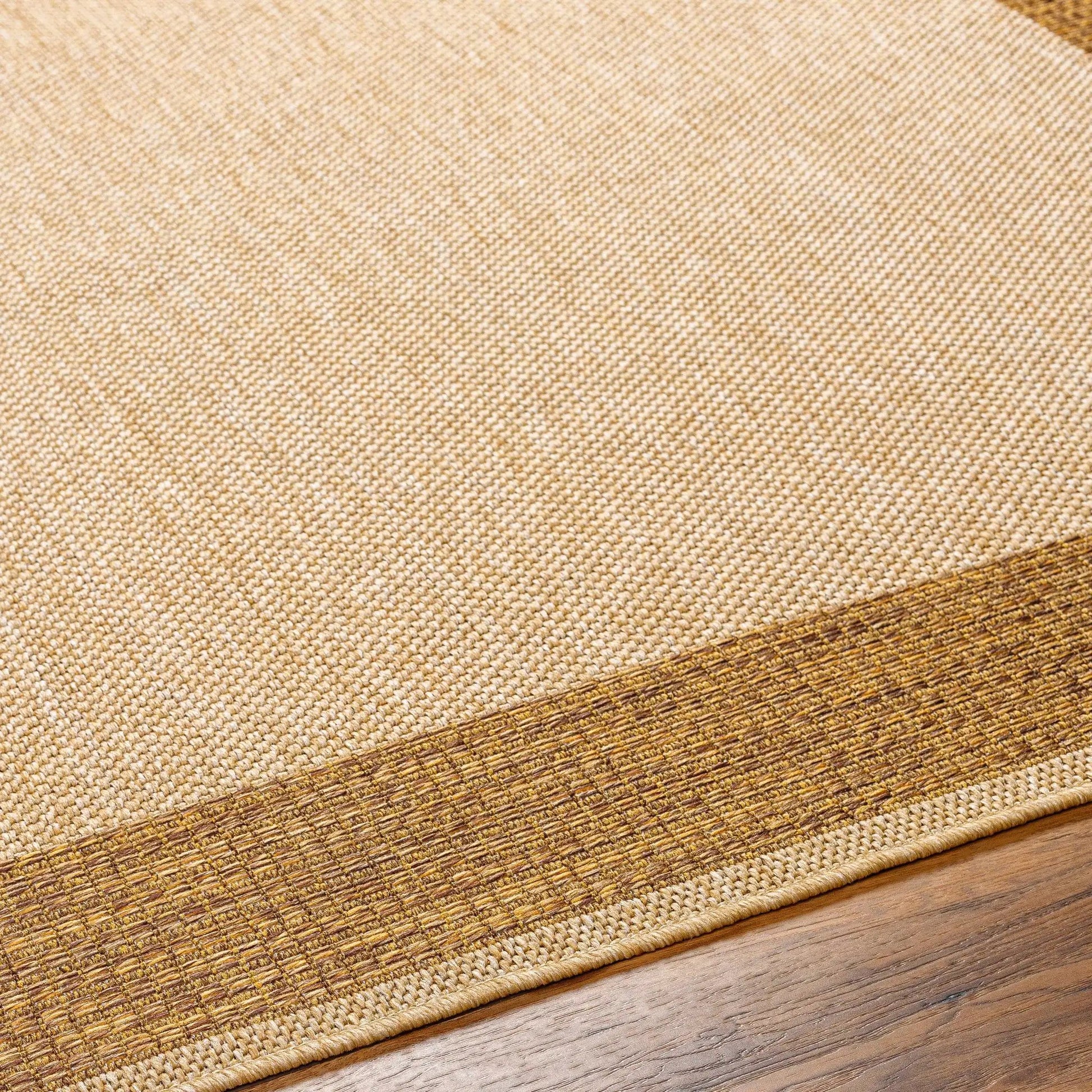 Inigo Flatweave Faux Jute Outdoor Rug, beige with brown border on Tampa Home & Garden Store