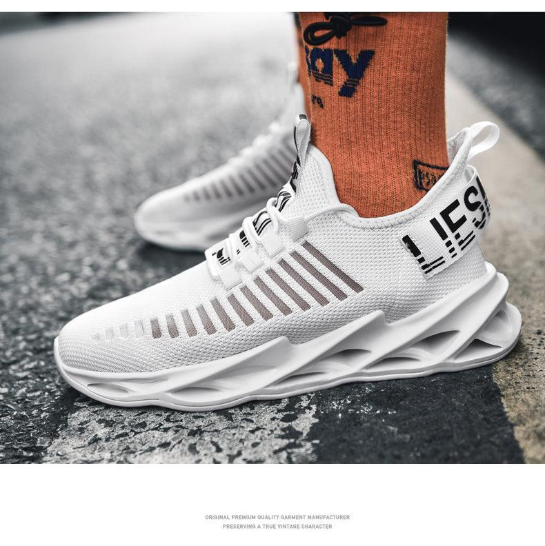 Pair of white Stevvex breathable mesh running sneakers with sculpted blade outsole on Tampa Home & Garden Store