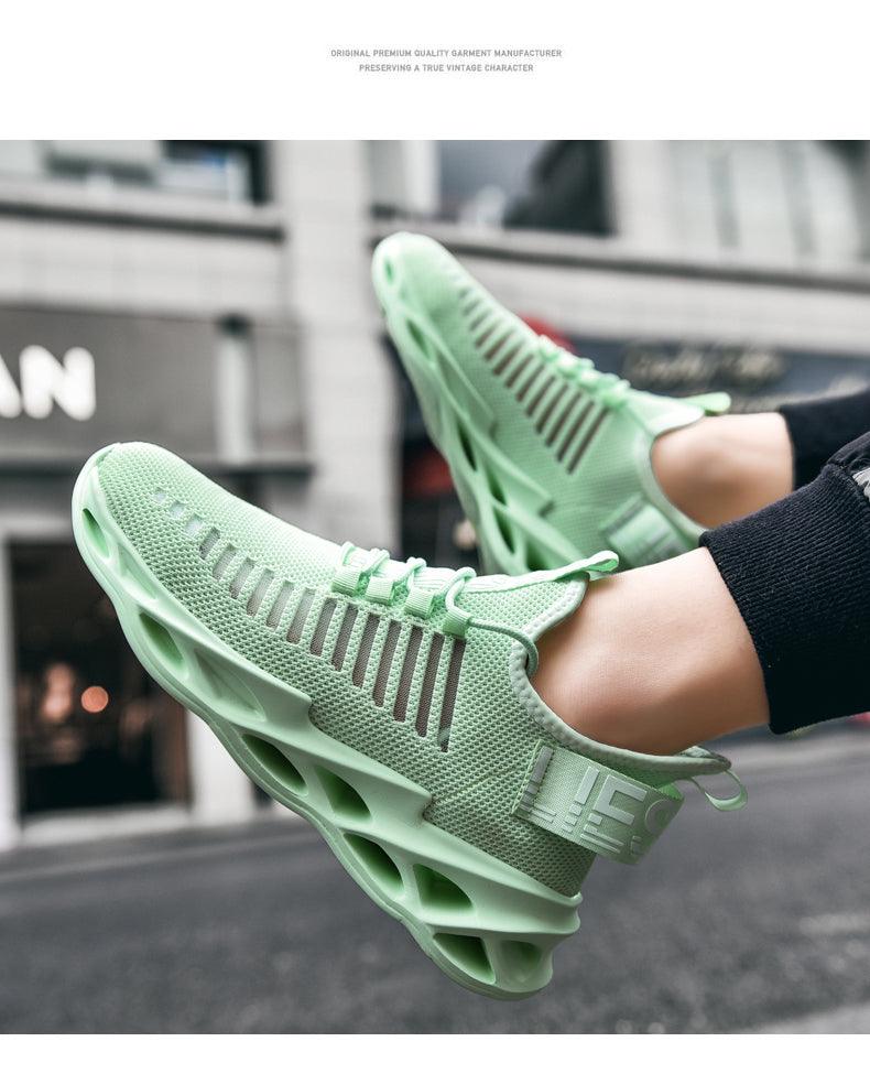 Pair of mint green breathable knit mesh running sneakers with hollow blade-like midsole on Tampa Home & Garden Store