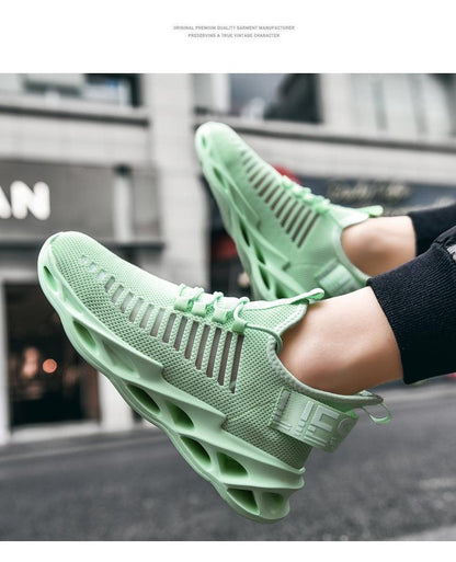 Pair of mint green breathable knit mesh running sneakers with hollow blade-like midsole on Tampa Home & Garden Store