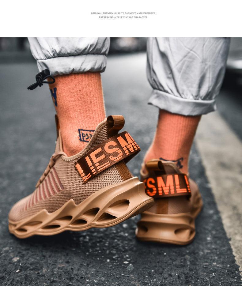 Stevvex men's sneakers in tan mesh with a chunky sole and orange strap lettering on Tampa Home & Garden Store
