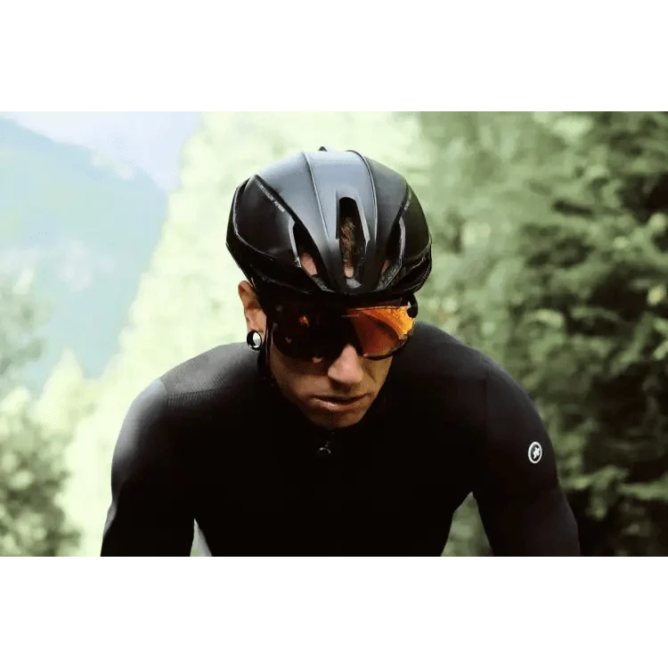 Sport riding sunglasses by Stevvex for men, orange lenses, sleek black frame worn by a cyclist on Tampa Home & Garden Store