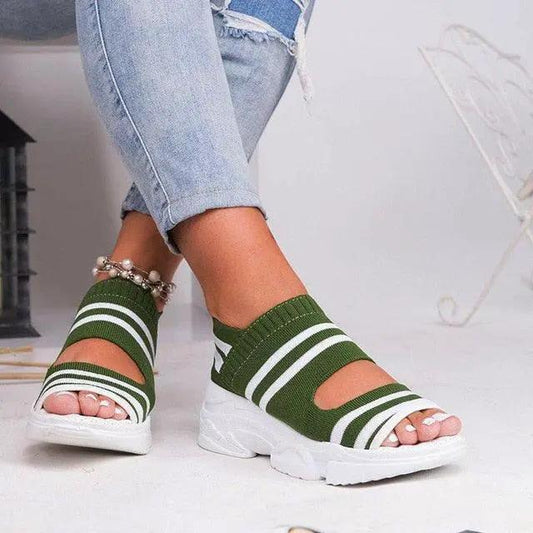 Pair of green knitted platform sandals with white striped bands, slip-on peep-toe design on Tampa Home & Garden Store