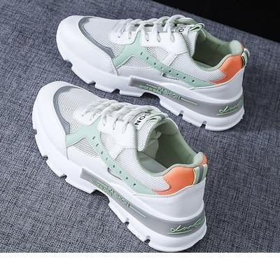 Stevvex women's running shoes, white mesh with mint green and coral accents, chunky sole pair on Tampa Home & Garden Store