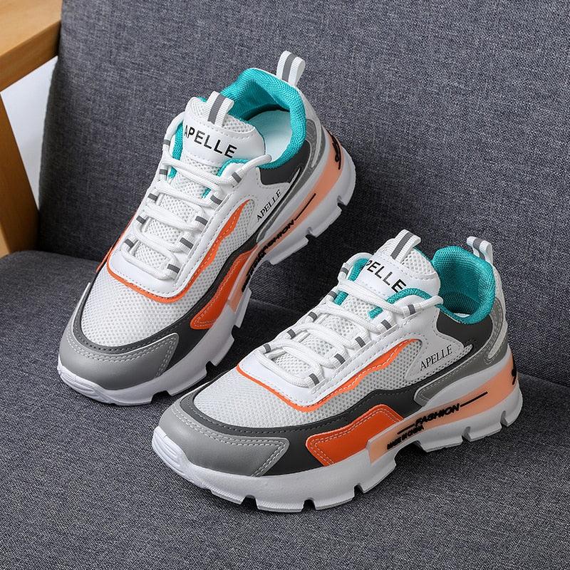 Stevvex women's running shoes white mesh with teal lining and orange accents APELLE logo on Tampa Home & Garden Store