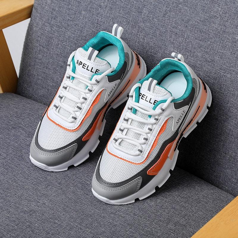 Stevvex athletic women's running shoes white mesh teal lining orange accents on Tampa Home & Garden Store