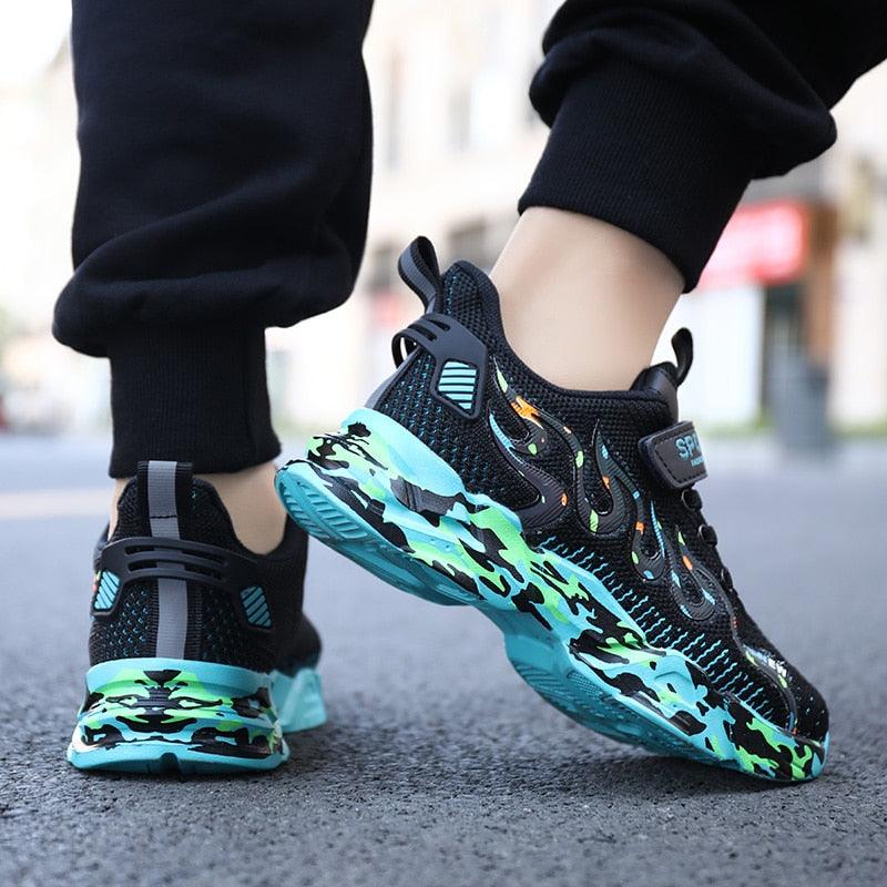 Stevvex pair of kids' breathable mesh sneakers with black upper and teal camo sole on Tampa Home & Garden Store