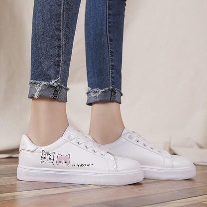 White lace-up women's sneakers with cat graphics on outer side for casual wear on Tampa Home & Garden Store