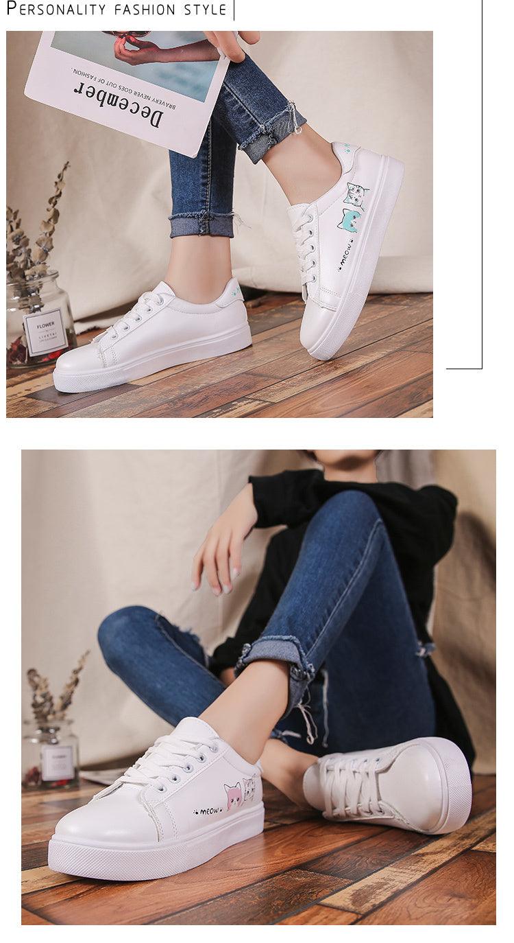 A pair of white PU leather platform sneakers for women with pastel cat graphics on the side on Tampa Home & Garden Store
White lace-up platform sneakers for women with cat graphics, shown with rolled denim jeans on Tampa Home & Garden Store