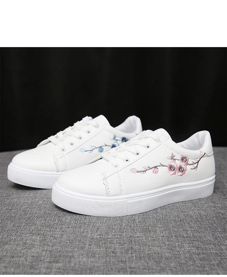 Pair of white PU leather platform sneakers with blue and pink floral embroidery on Tampa Home & Garden Store