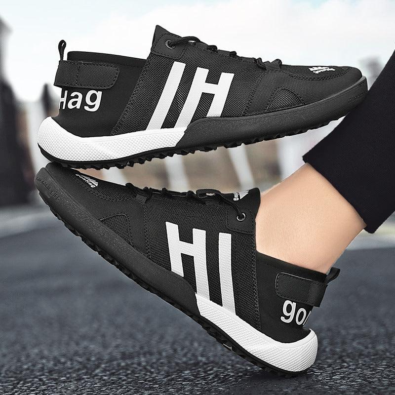 Stevvex black mesh slip-on sneakers, lightweight breathable with white HI branding, pair on Tampa Home & Garden Store