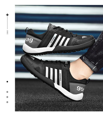 Stevvex GOHAG black mesh sneakers with white stripes, breathable casual walking shoes on Tampa Home & Garden Store